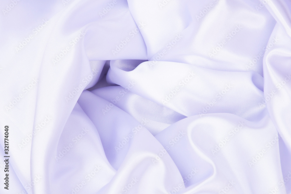 White wrinkled fabric with wrinkles and waves, background and Wallpaper of crumpled tissue.