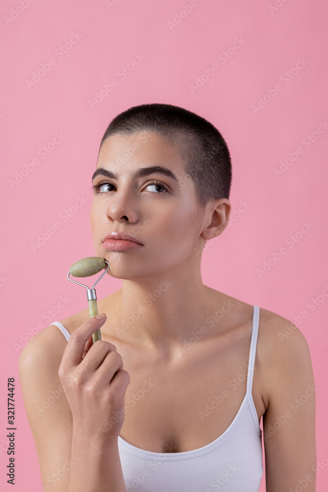 Thoughtful young lady looking away and frowning stock photo Thoughtful young lady looking away and frowning stock photo