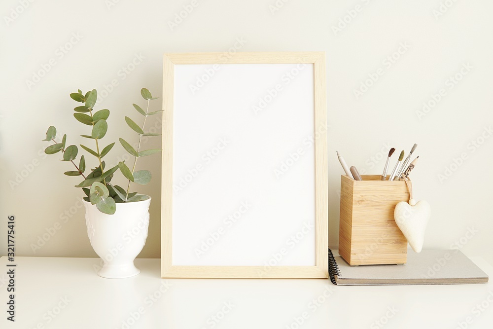 Minimalist interior empty frame mock up on white background, eucalyptus and wooden decoration.        - obrazy, fototapety, plakaty 