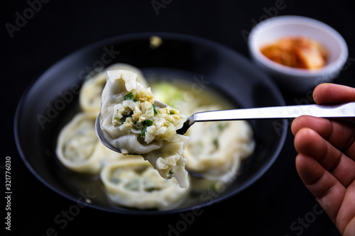 Dumpling soup which is called ManDutGuk in Korean photo