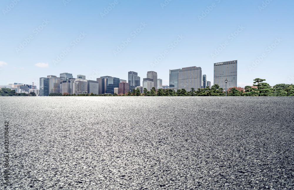 Modern city with empty road and blue sky