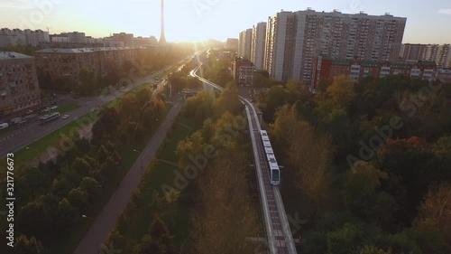 Monorail and train in Moscow in the evening aerial