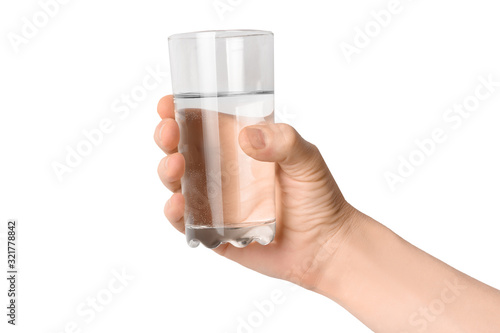 Glass of water in a man's hand isolated on white background