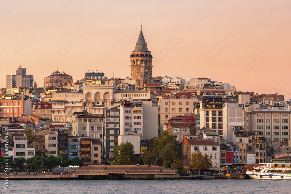 Galata Tower at Karakoy district and Golden Horn at twilight in Istanbul
