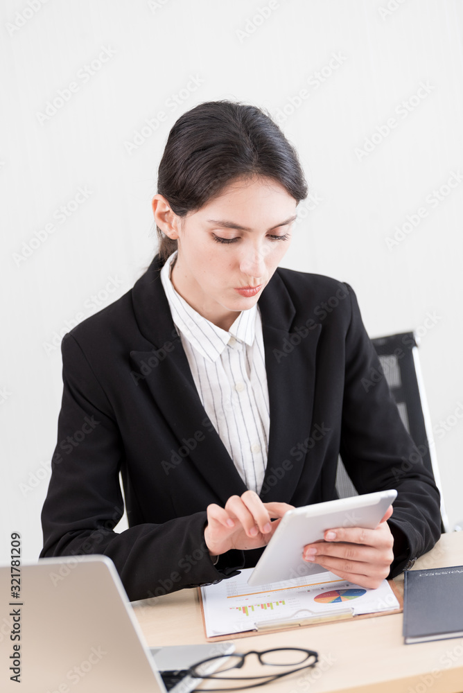 A businesswoman has working with concentrate and happiness. A businesswoman has working with concentrate and happiness.