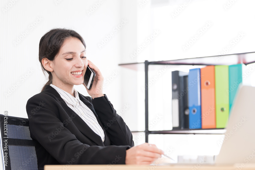 A businesswoman has talking about the job with concentrate and happiness. A businesswoman has talking about the job with concentrate and happiness.