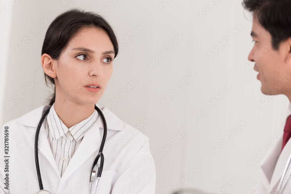 Two doctors have working together with happiness in the hospital. Two doctors have working together with happiness in the hospital.