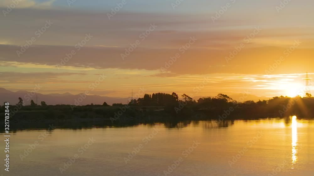 Left to right panning motion of sunset behind the Wairau River at the Wairau bar,Blenheim,Marlborough,South Island New zealand Left to right panning motion of sunset behind the Wairau River at the Wairau bar,Blenheim,Marlborough,South Island New zealand
