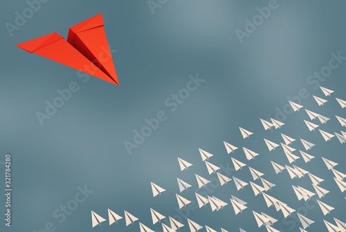 3D illustration of leadership success business concept rocket paper fly over color background lead rocket stand out of other paper rocket follower