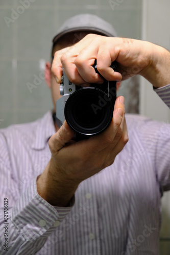 man holding digital camera 