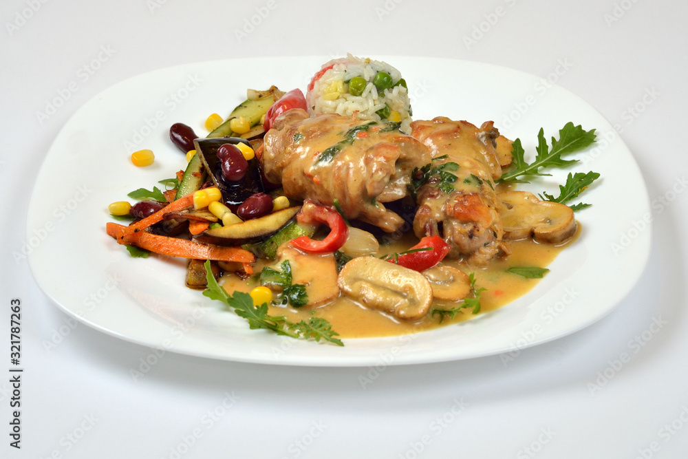 Food from a chicken restaurant with vegetables and sauce. Food from a chicken restaurant with vegetables and sauce.