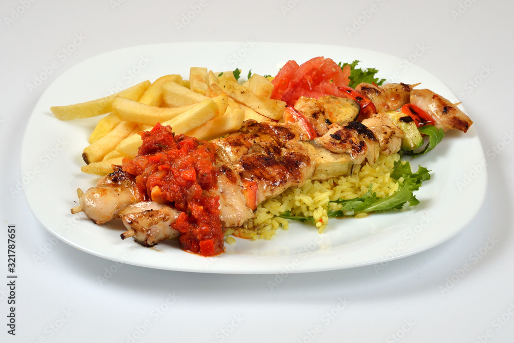 Food from a chicken restaurant with vegetables and sauce. Food from a chicken restaurant with vegetables and sauce.