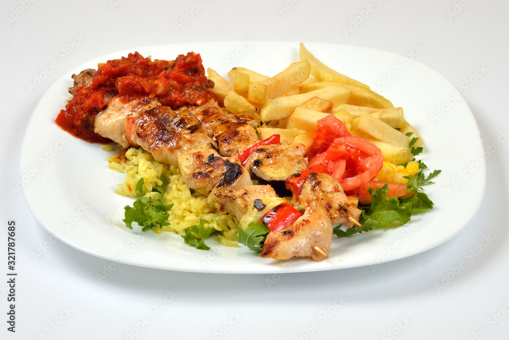 Food from a chicken restaurant with vegetables and sauce. Food from a chicken restaurant with vegetables and sauce.