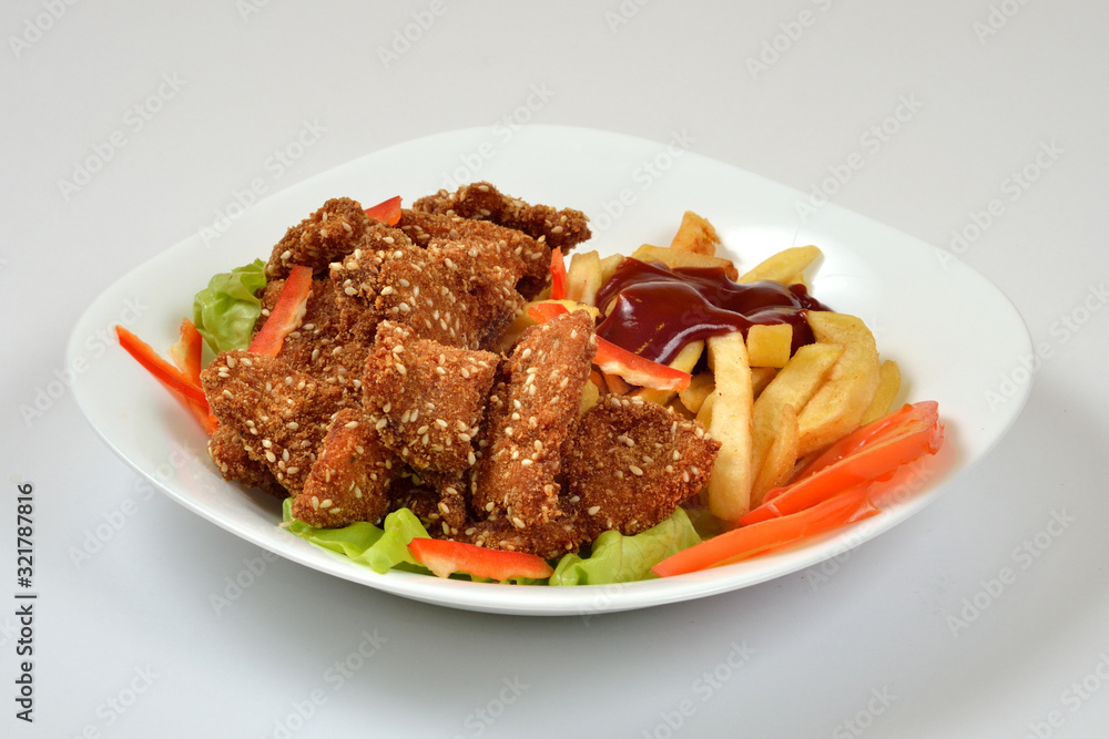 Food from a chicken restaurant with vegetables and sauce. Food from a chicken restaurant with vegetables and sauce.