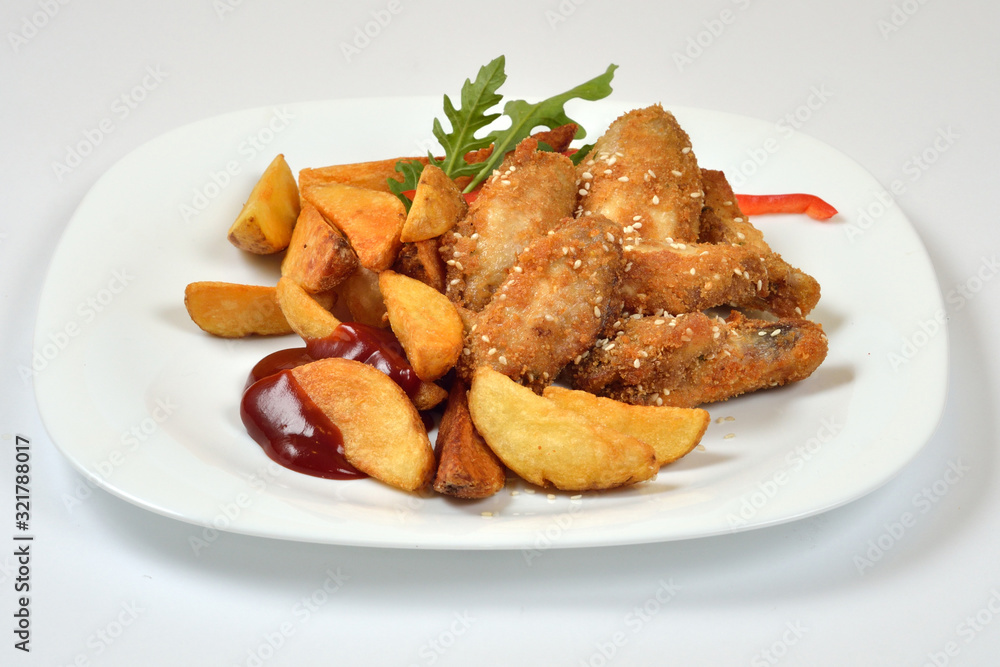 Food from a chicken restaurant with vegetables and sauce. Food from a chicken restaurant with vegetables and sauce.
