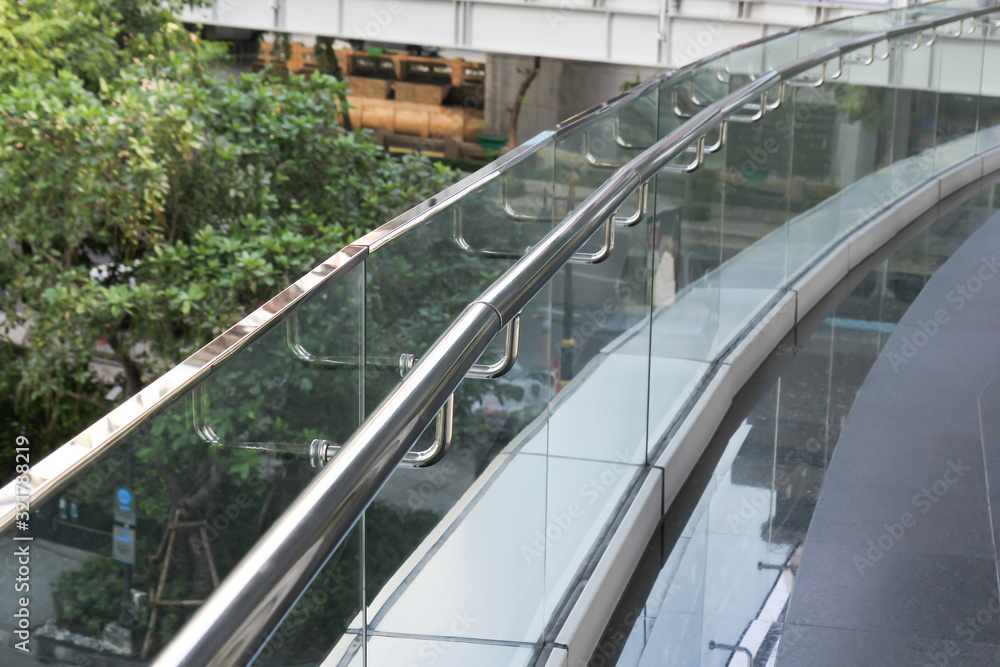 tempered glass of walk way balcony with stainless steel handrail. tempered glass of walk way balcony with stainless steel handrail.