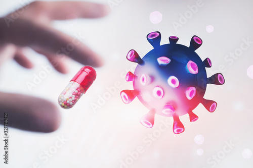 Hand holding pill and coronavirus molecule photo