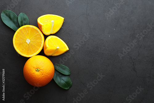 Foto Orange citrus fruit on a stone table. Orange background.