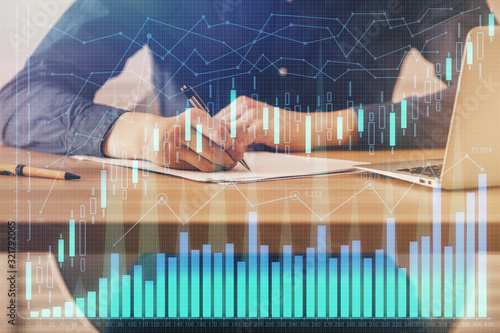 Double exposure hands with stock market chart. © peshkova