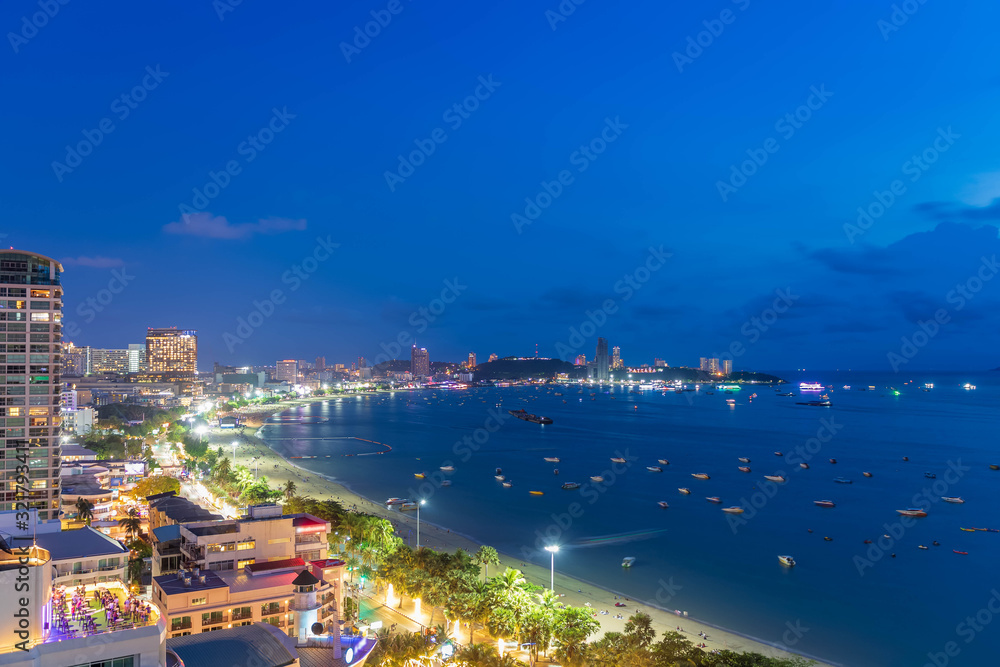 Pattaya bay beach harbor, famous seaside resort city, during twilight, Chonburi, Thailand