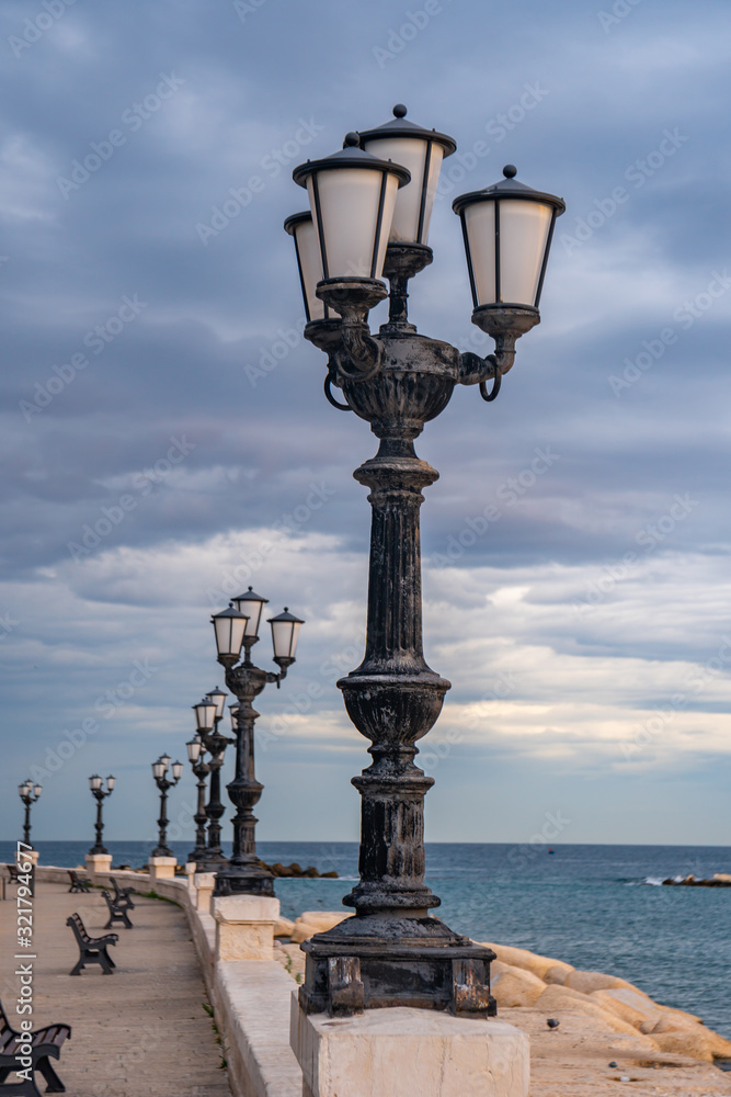 Bari seafront lights. Coastline and Twilight purple and blue sky.