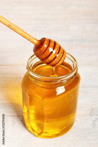 Jar of Honey with Honey Dipper photo