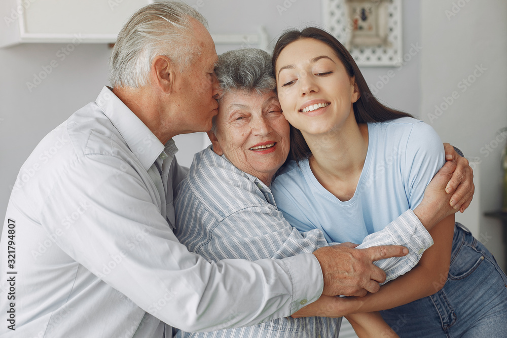 Couple in a room. Grandparents sitting at home. Couple in a room. Grandparents sitting at home.