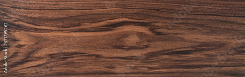 Texture of black walnut board with oil finish