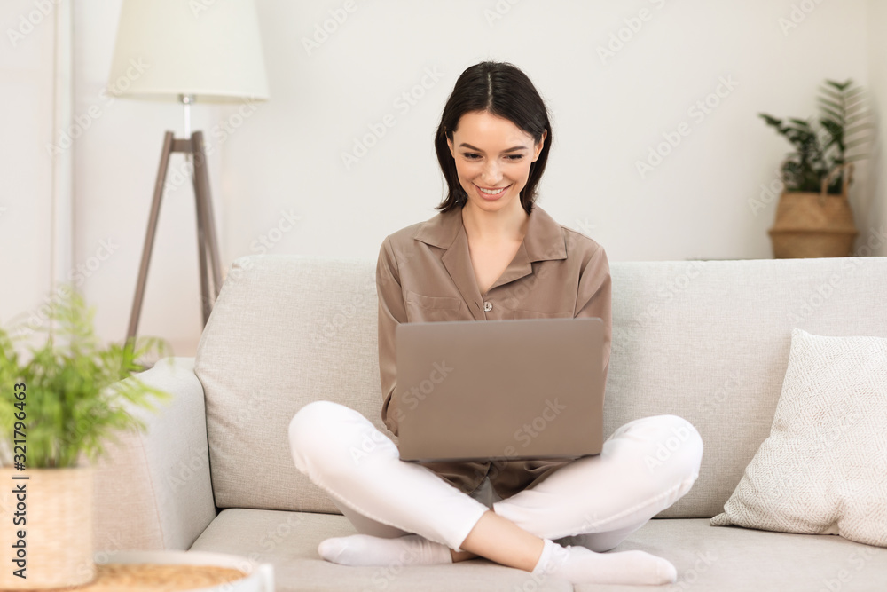Young girl working on laptop online at home Young girl working on laptop online at home