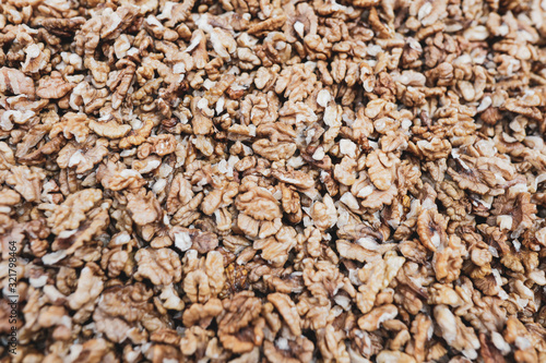 Shallow depth of field (selective focus) image with walnut kernels piled together.