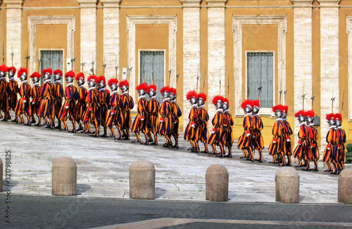 Changing of Swiss guards at a side entry next to St.Peter Basilica  in Vatican city. photo