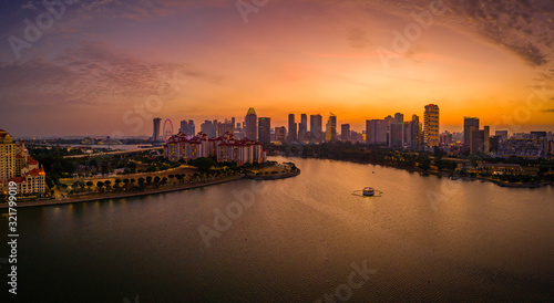 Kallang river overlooking at the stadium and Singapore skyline during sunset © Huntergol