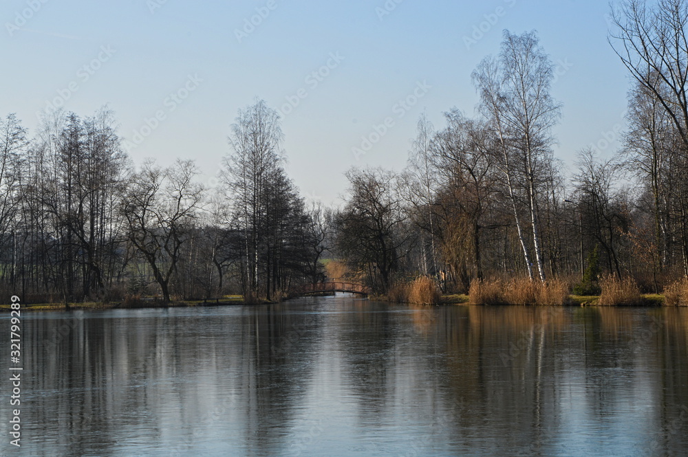 Chorzow Polska Śląsk. Picturesque reflection of trees in the lake surface. Chorzow Polska Śląsk. Picturesque reflection of trees in the lake surface.