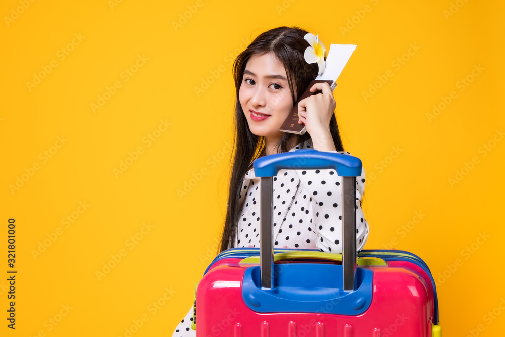 Tourist woman in summer casual clothes.Asian Smiling woman .Passenger traveling abroad to travel on yellow background.Asian woman going to summer vacation.Travel trip funny. Tourist woman in summer casual clothes.Asian Smiling woman .Passenger traveling abroad to travel on yellow background.Asian woman going to summer vacation.Travel trip funny.