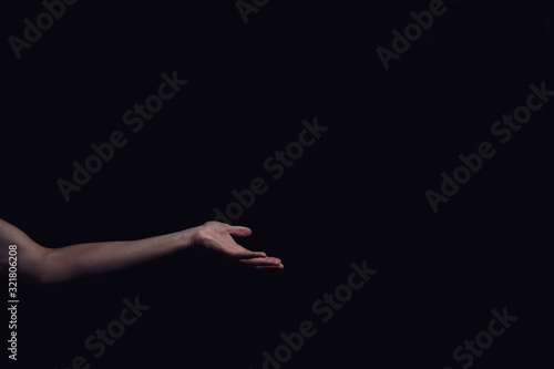 hand on a black background