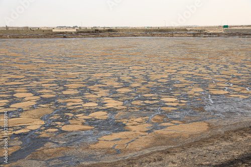 Waste oil drying field where industrial oil waste is dumped for evaporation