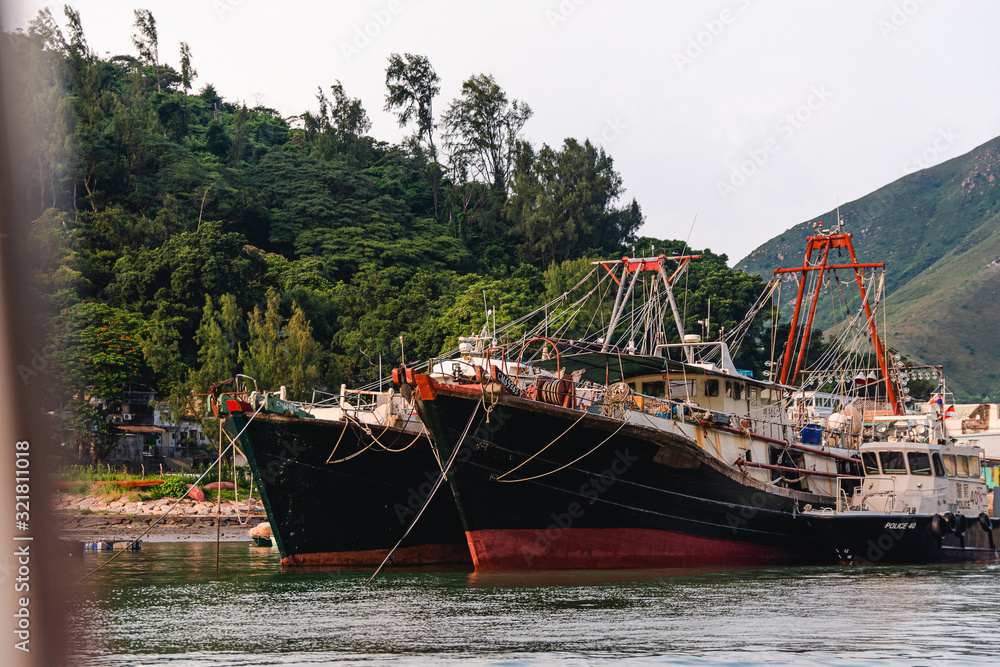 Two big fisher boats laying in the bay of Tai O village in Hong Kong Two big fisher boats laying in the bay of Tai O village in Hong Kong