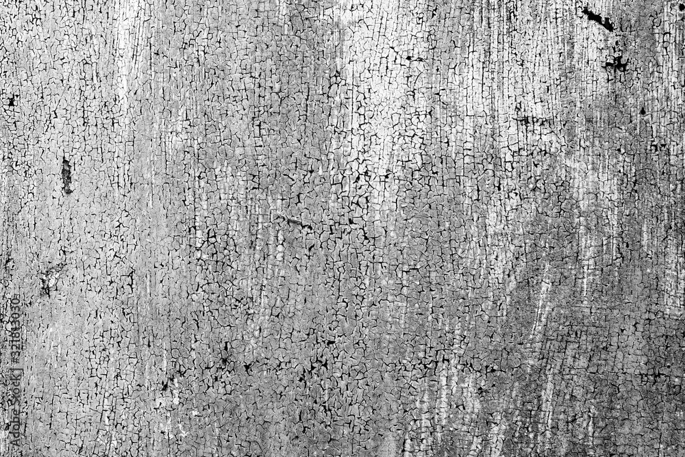 Fototapeta premium Texture of a metal wall with cracks and scratches which can be used as a background