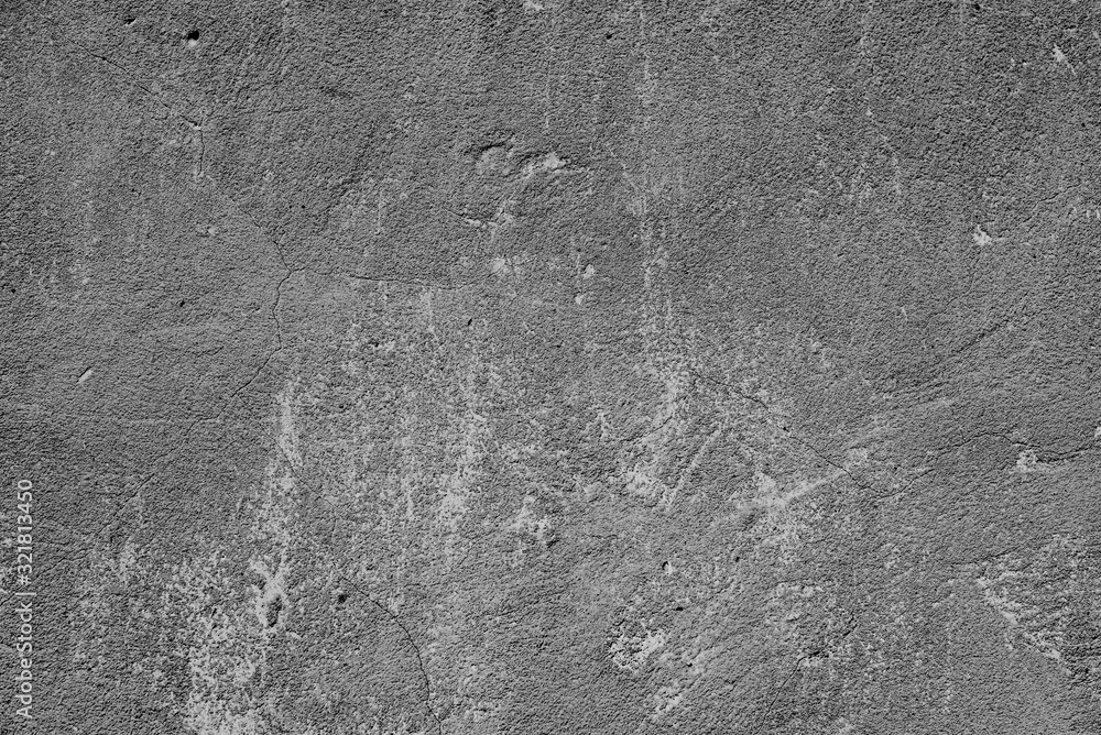 Naklejka premium Texture of a concrete wall with cracks and scratches which can be used as a background