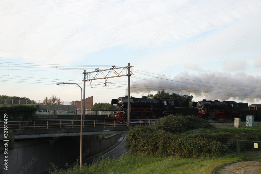 Two old steam locomotives running on the track at Nieuwerkerk aan den Ijssel Two old steam locomotives running on the track at Nieuwerkerk aan den Ijssel