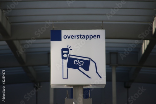 White and blue information sign at platform for transfer to internationa trains at Utrecht central station photo
