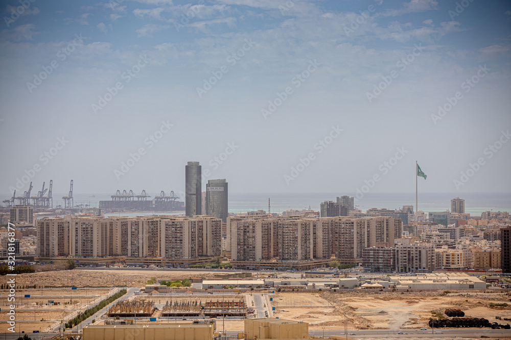 Buildings and Saudi Arabian flag, Flag Round about, Jeddah City, Saudi Arabia August 2019