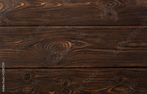 Background made of natural brown wood with light streaks, with texture elements.