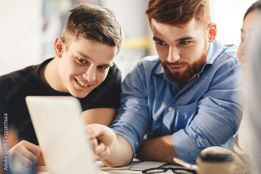 Smart student helping his classmate with homework Smart student helping his classmate with homework