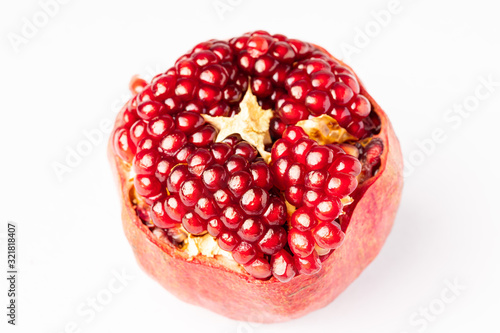 Fresh Pomegranate isolated on white photo