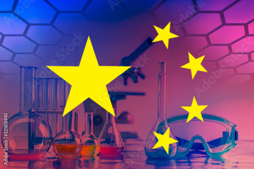 Stars from the Chinese flag on the background of chemical dishes.Research in the field of chemistry in the Republic of China. Microbiology in China. Laboratory research in the field of medicine in PRC