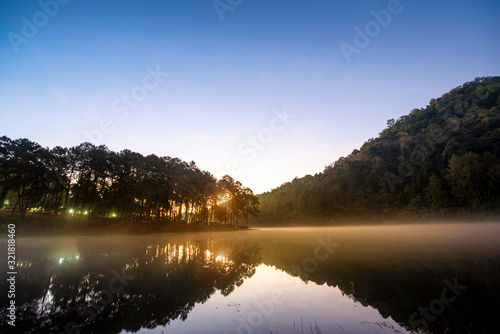 Fototapeta Naklejka Na Ścianę i Meble -  Morning light at Pang Ung (Pang Tong reservoir) in the mist at sunrise, Mae Hong Son province, Thailand,forest background. Concept Travel