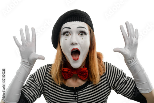 Afraid female mime on white background. Woman performing a pantomime sketch