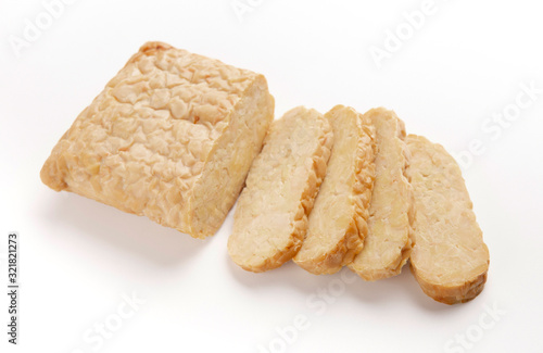 Photos Tempeh cut into slices, isolated on white background