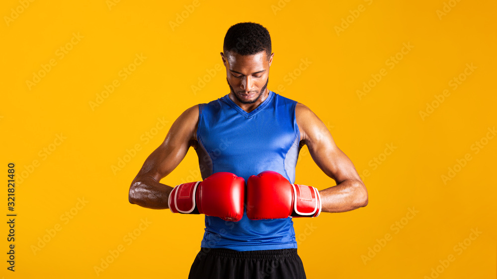 Handsome afro sports man ready for fight at studio